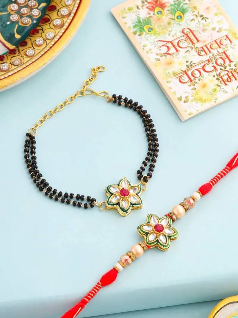 set of 2 gold toned kundan studded floral shape bhaiya bhabhi rakhi with roli chawal chandan & mishri
