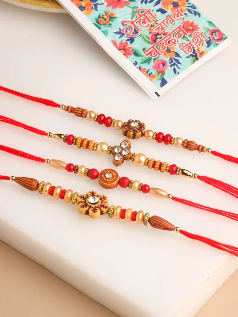 set of 4 red artificial stones & beads floral shape thread rakhi with roli chawal chandan & mishri