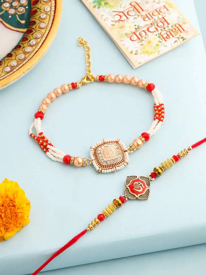 set of 2 gold toned artificial stones & beads om design bhaiya bhabhi rakhi with roli chawal chandan & mishri