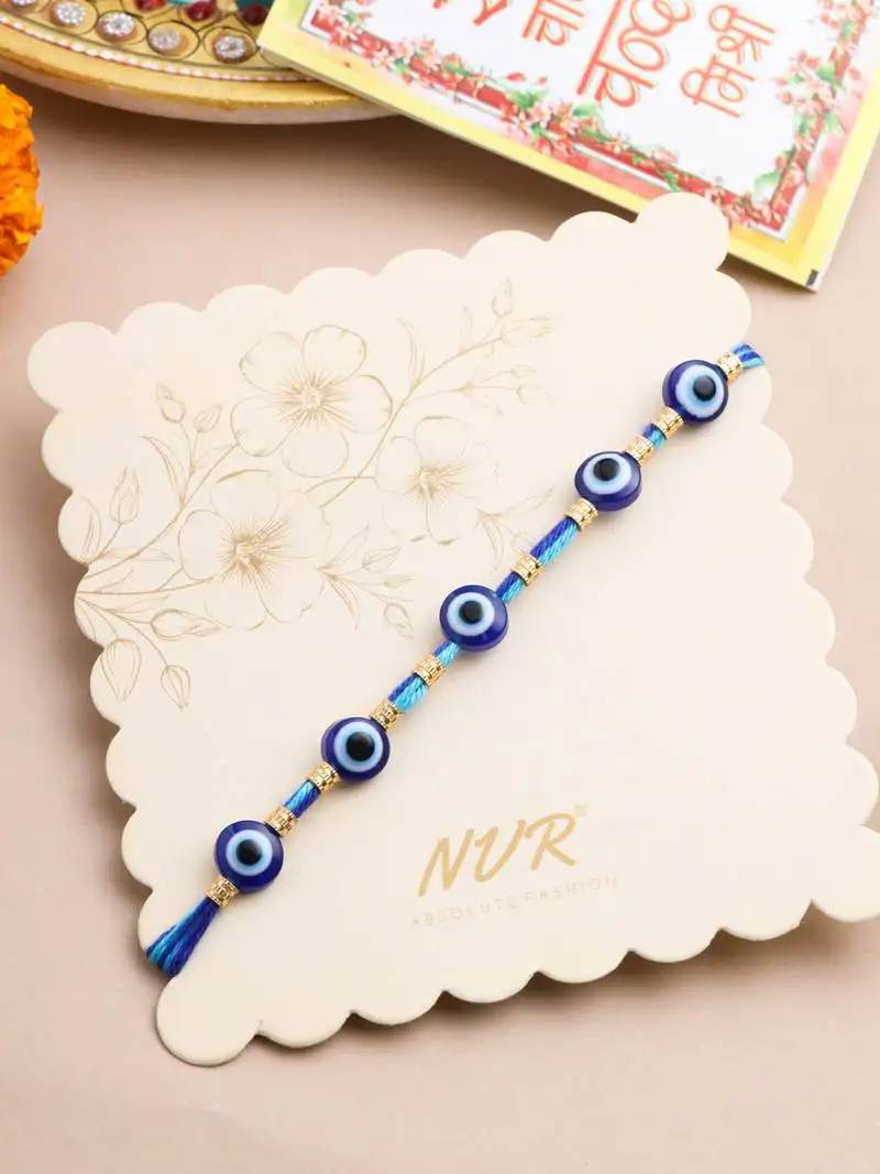 Blue evil eye thread rakhi with roli chawal chandan & mishri