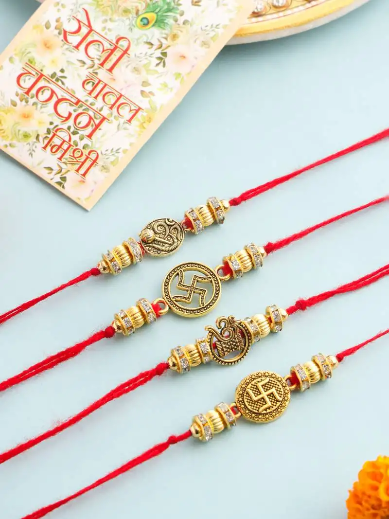 set of 4 gold toned artificial stones swastik design thread rakhi with roli chawal chandan & mishri
