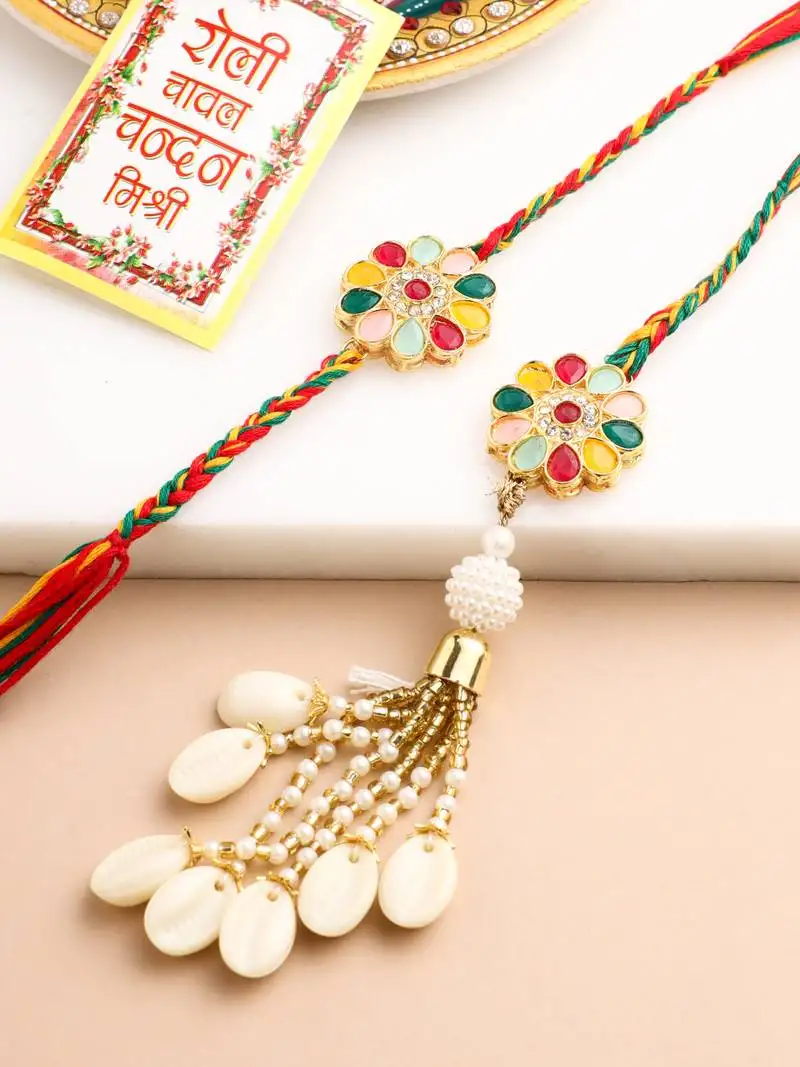 set of 2 artificial beads & sea shell floral design bhaiya bhabhi rakhi with roli chawal chandan & mishri