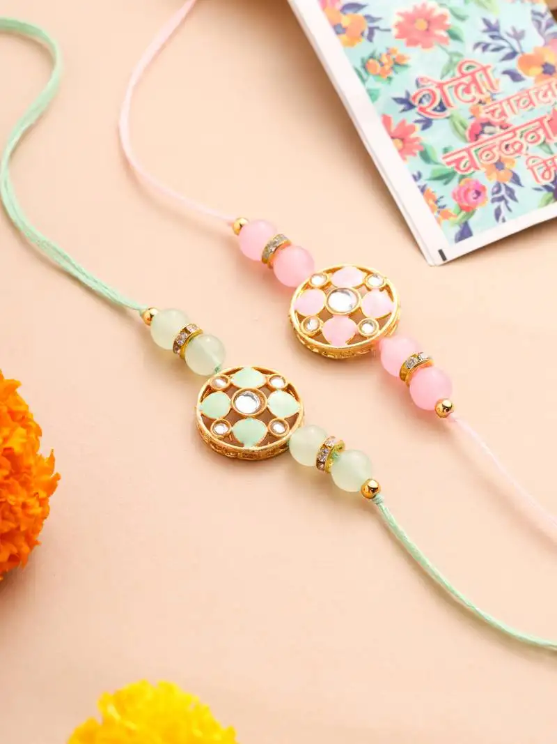 set of 2 artificial stones & beads floral design thread rakhi with roli chawal chandan & mishri