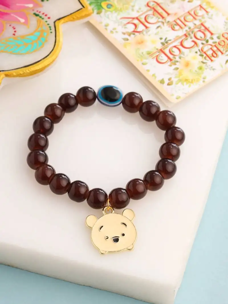 Kids cartoon design brown artificial beads thread rakhi with roli chawal chandan & mishri