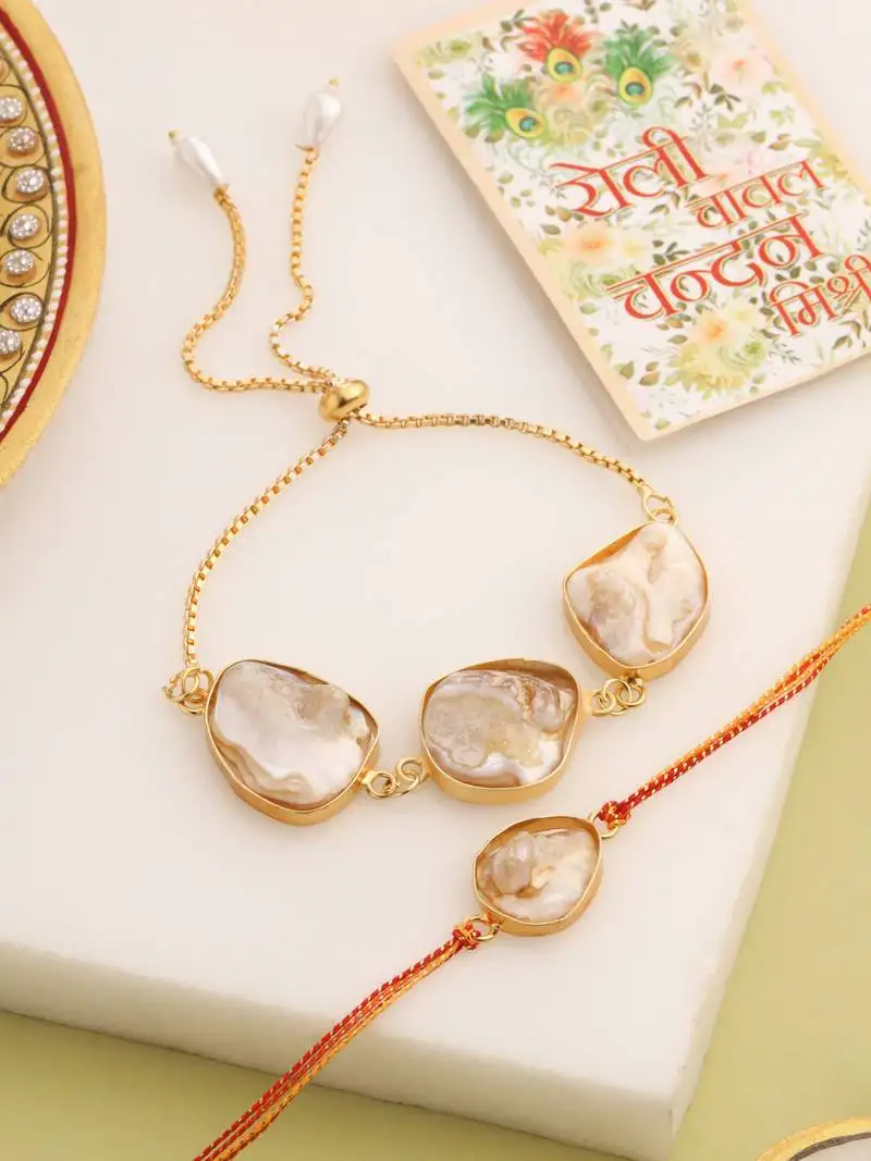 set of 2 gold toned pearls bhaiya bhabhi rakhi with roli chawal chandan & mishri