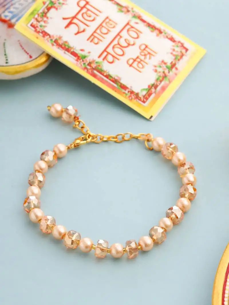 Women gold toned artificial beads wraparound rakhi with roli chawal chandan & mishri