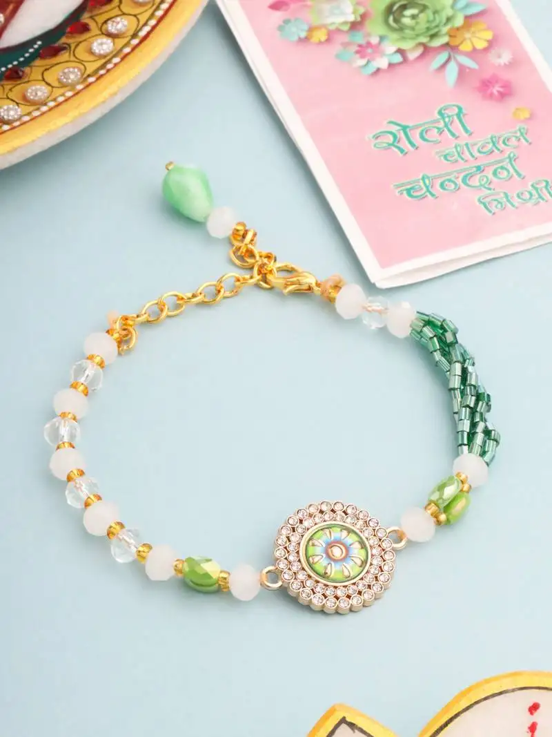green artificial stones & beads floral wraparound rakhi with roli chawal chandan & mishri