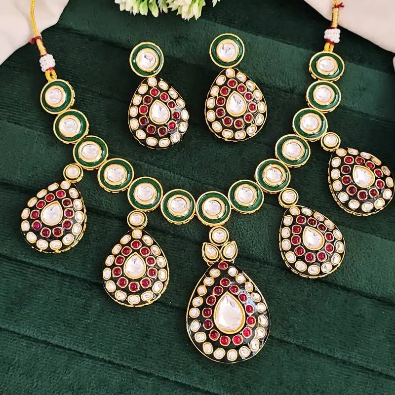 Traditional indian kundan necklace set with earrings, green enamel and ruby red stones, gold-plated