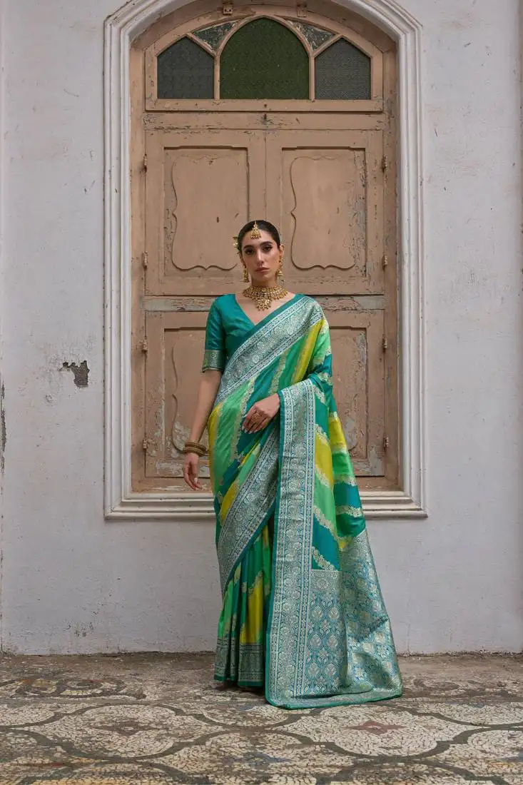 Green banarasi silk blend weaving saree with zari woven fancy tassels