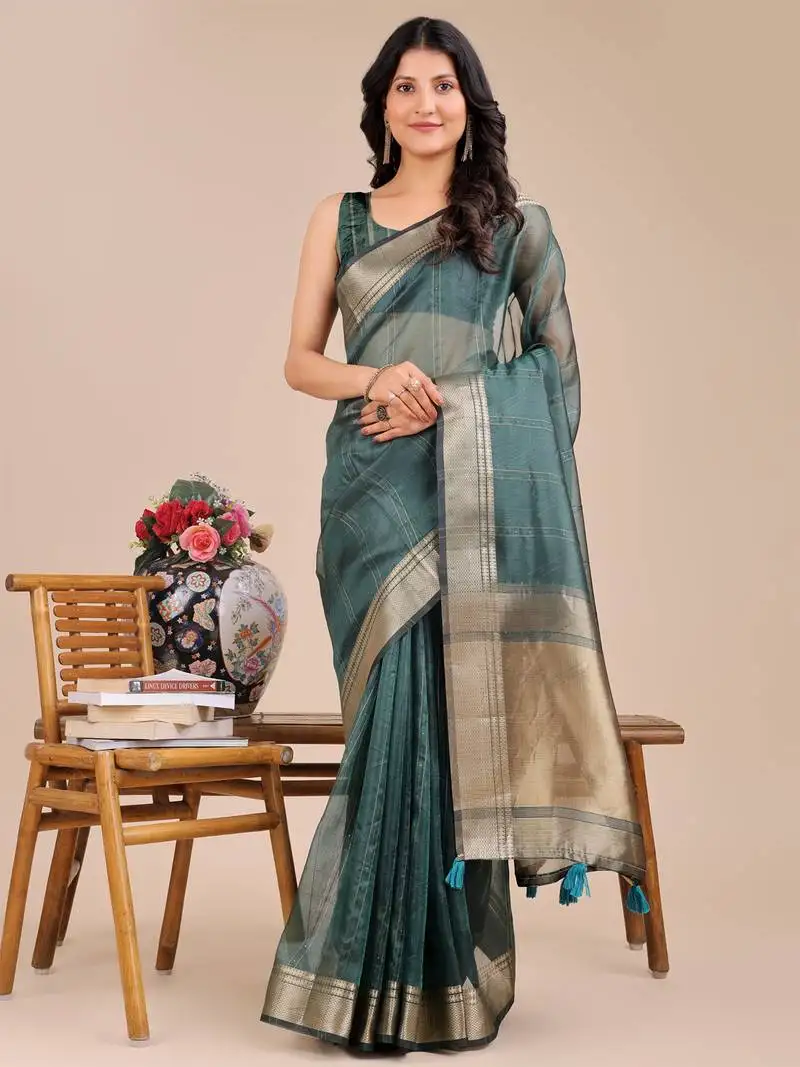 Dark green organza woven zari work tassel saree