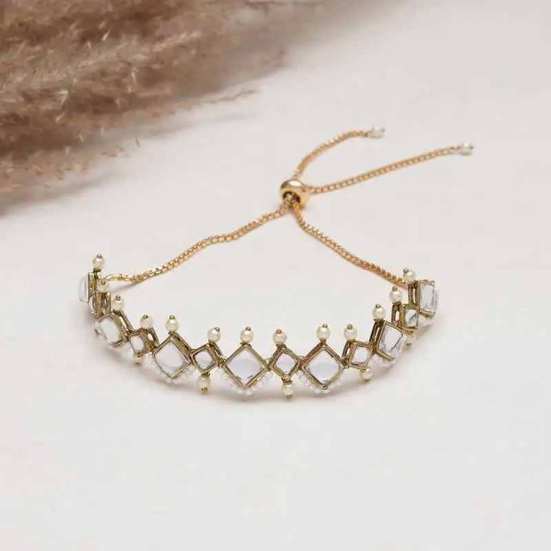 Golden kite shaped kundan with white pearls adjustable bracelet