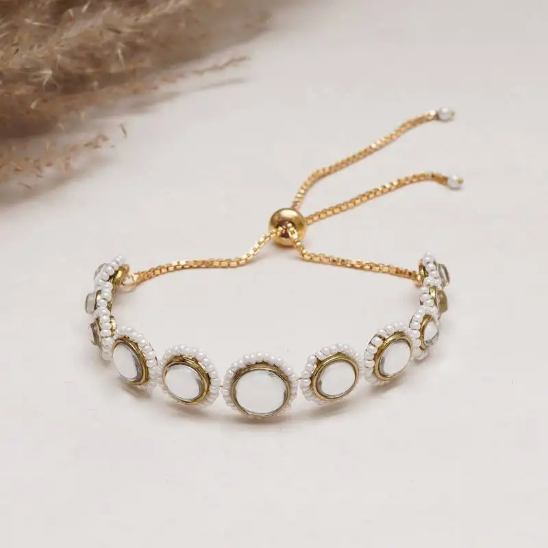 Golden circular kundan with white pearls adjustable bracelet
