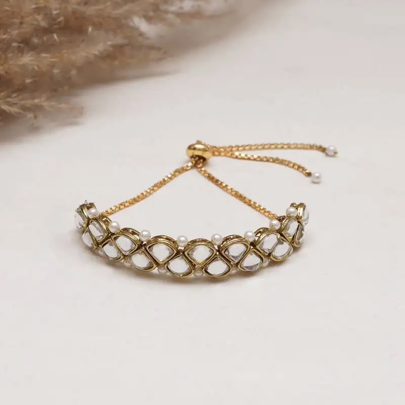 Golden triangle kundan with white pearls adjustable bracelet