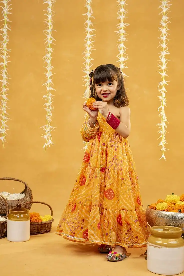 Yellow bandhni printed gathered one shoulder full sleeve dress