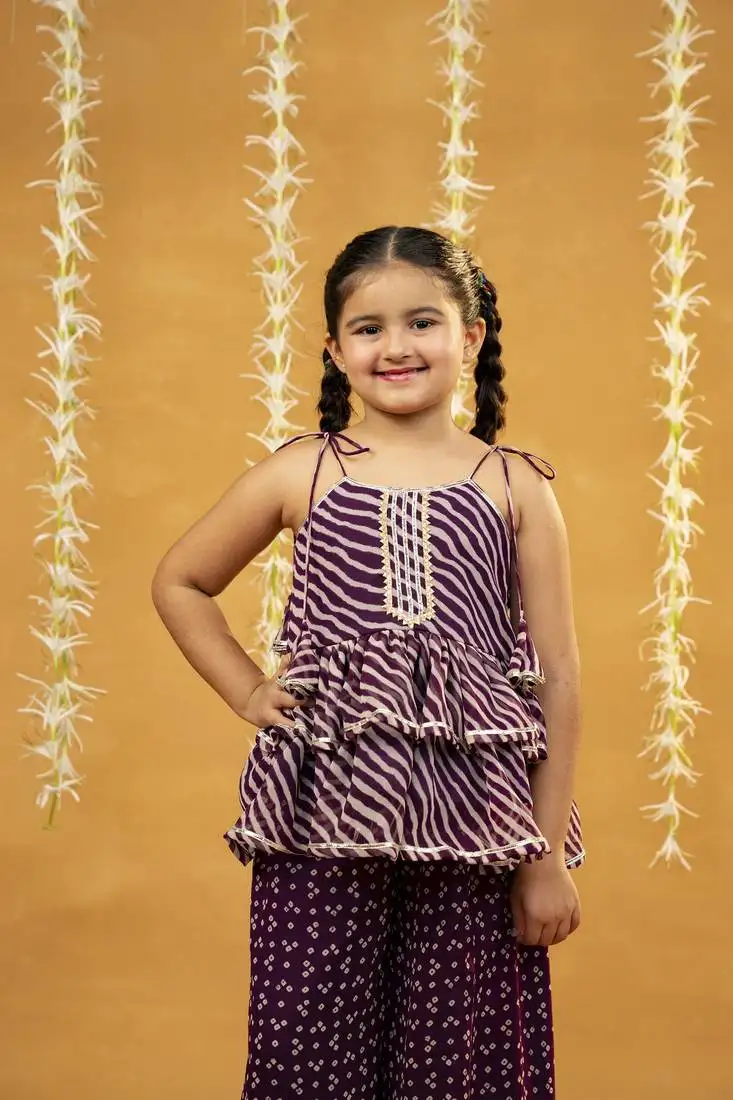 Purple bandhni and leheriya printed tie-up straps peplum top and flared palazzo