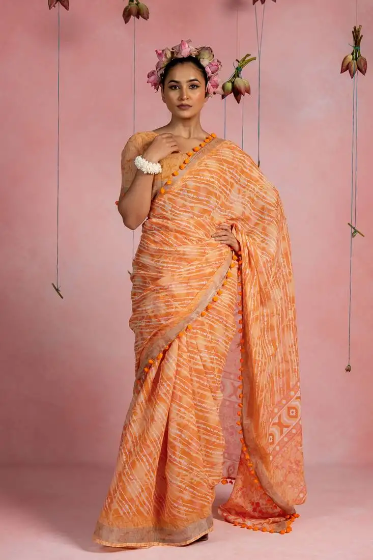 Orange cotton blend stripegeometric print lace border saree with unstitched blouse piece