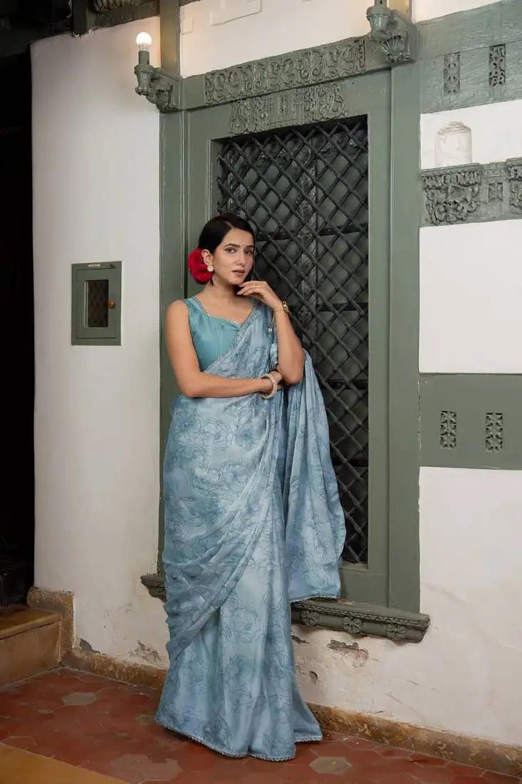 Light dusty blue chiffon foil floral print lace border saree with unstiched blouse piece