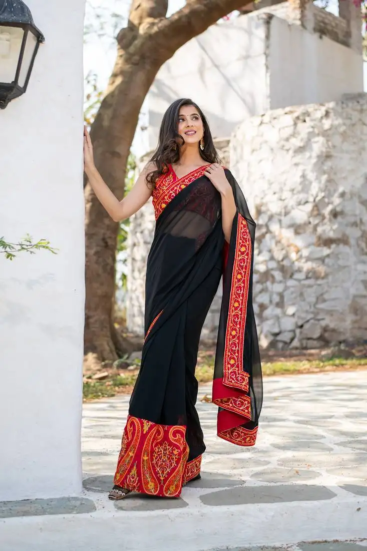 Red and black thread work saree