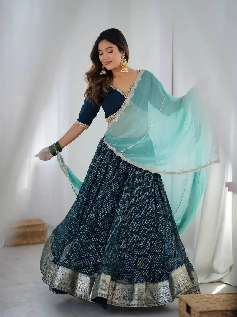 Teal blue lehenga with blouse and powder blue dupatta