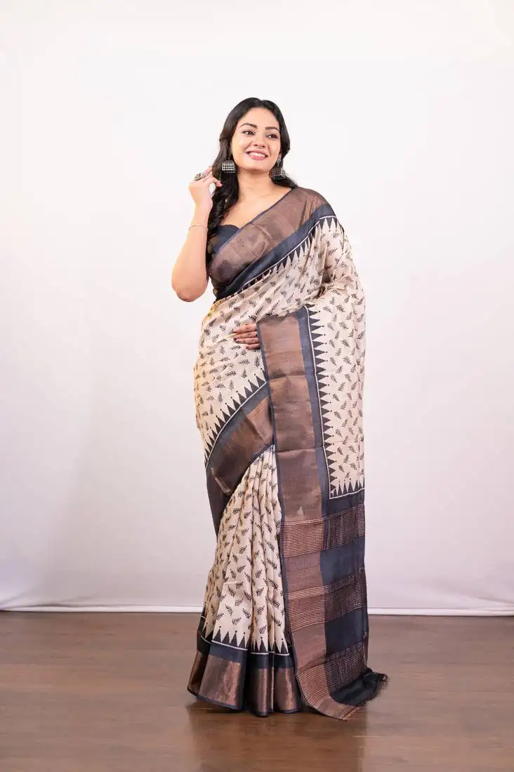 Offwhite and black pure handloom tussar silk saree with golden zari border pallu