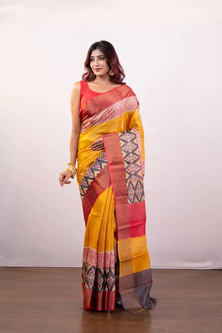 Yellow handpainted pure tussar silk saree with red alpana design and multi pallu