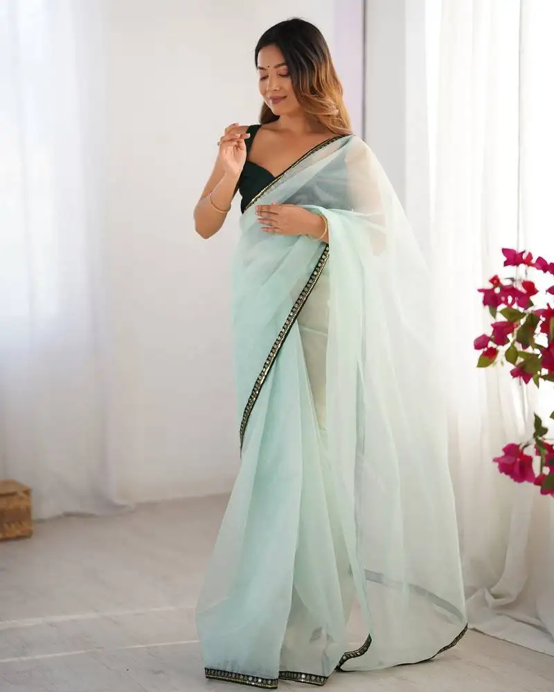 Sea green twill net embroidered lace saree