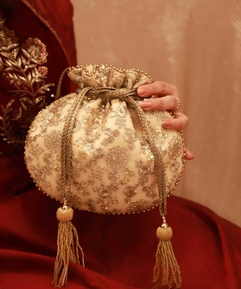 Ada embroidered potli - gold