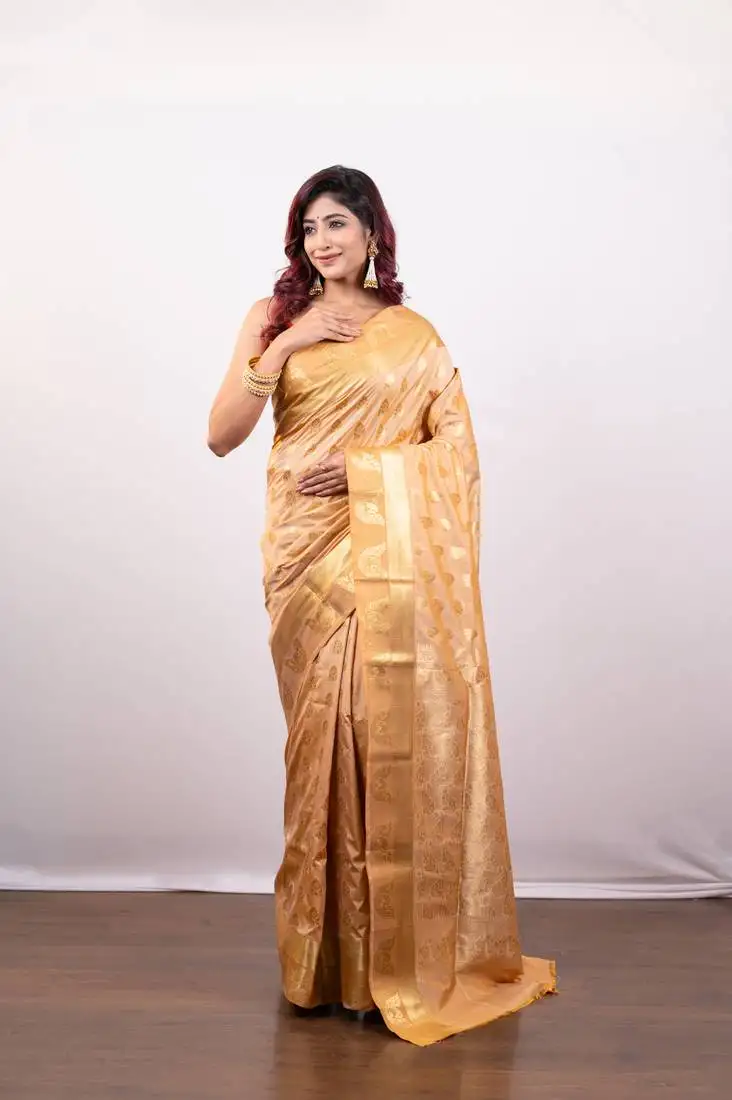 Kanjivaram art silk saree in peach cover floral motifs and border