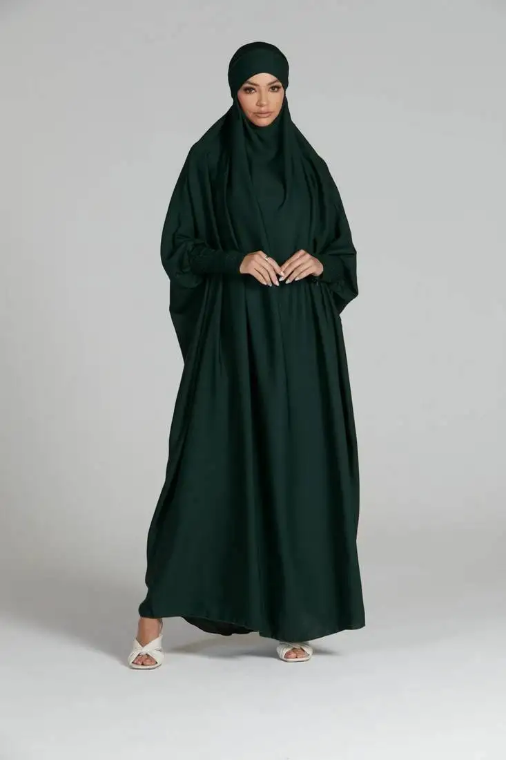 Green one piece jilbab in firdaus with smocky sleeves and attached mouthpiece