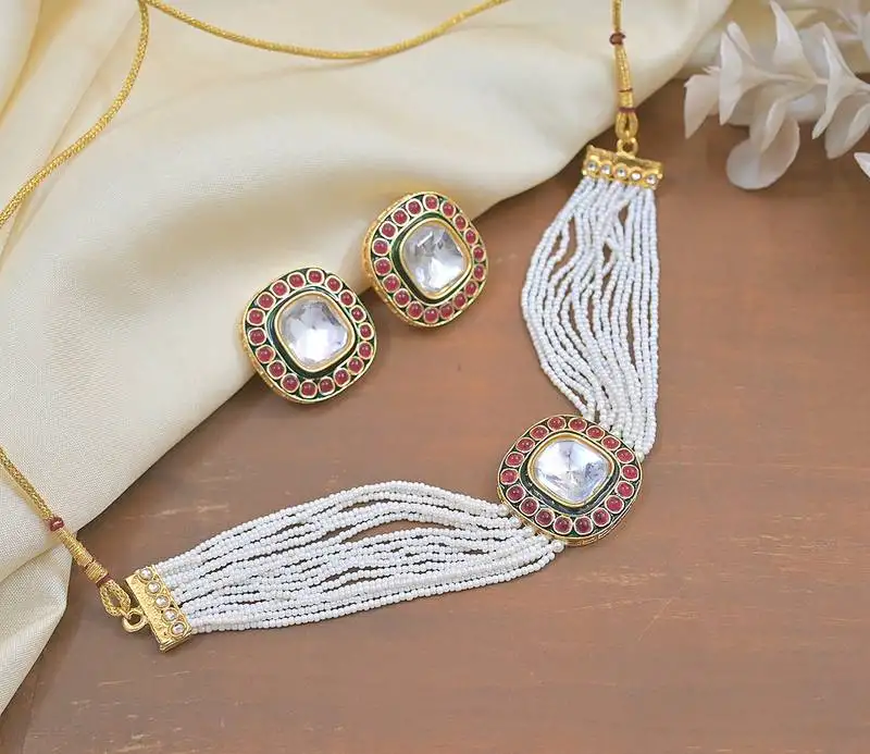 Handcrafted kundan pearl necklace set with ruby red stones - traditional indian wedding jewelry with earrings