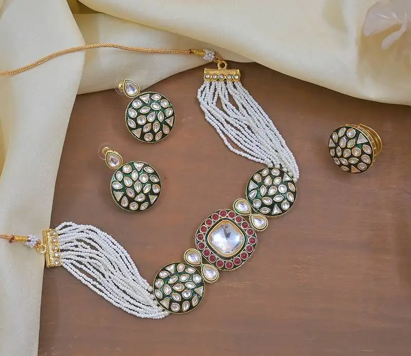 Luxury kundan pearl side necklace set - handcrafted indian bridal jewelry with green meenakari and ruby accents