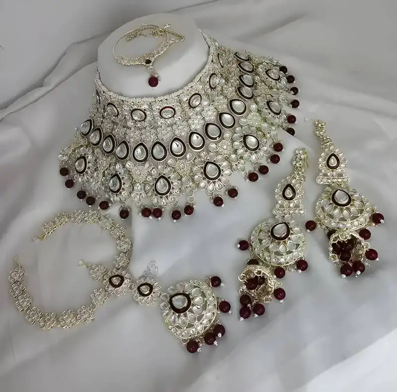 Luxurious maroon kundan bridal set - complete semi wedding jewelry collection with pearl embellishments