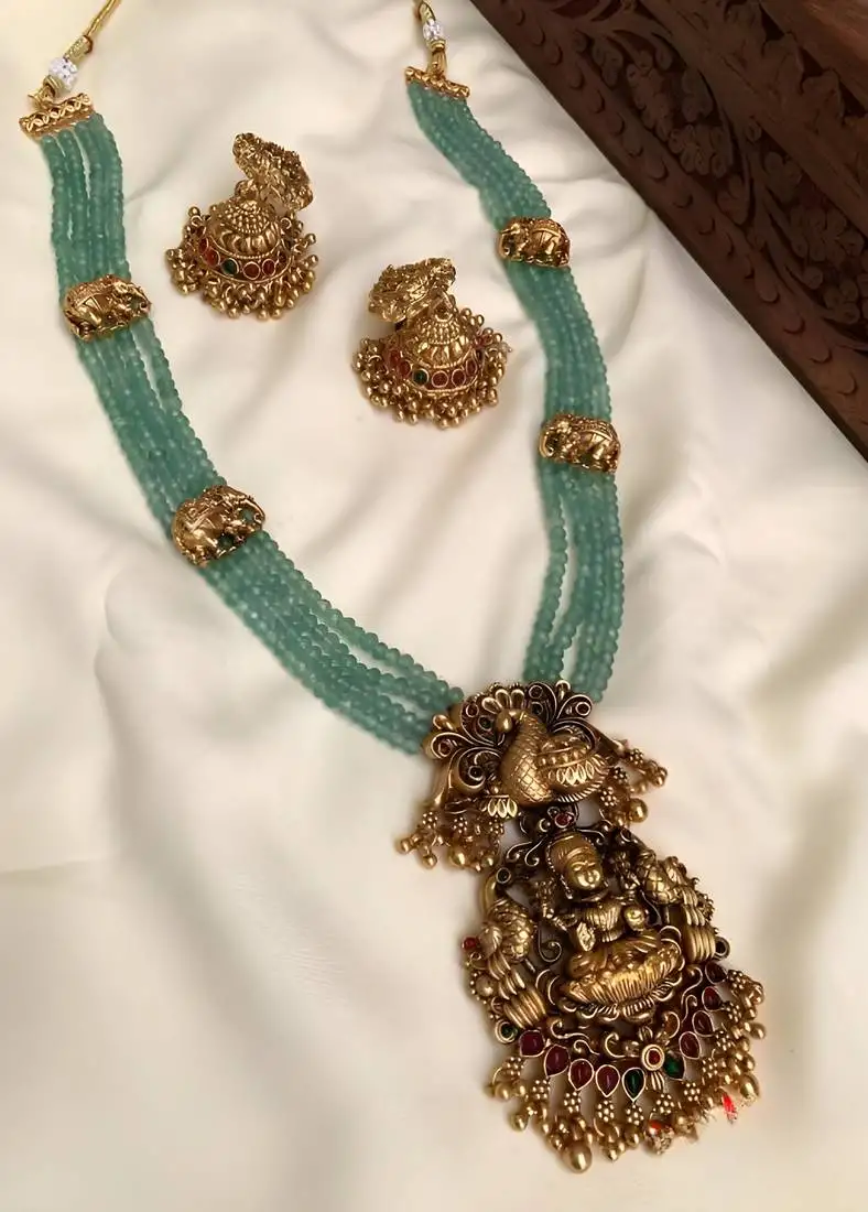 Luxurious emerald green temple goddess kundan jewelry set - handcrafted gold-plated bridal necklace with jhumka earrings