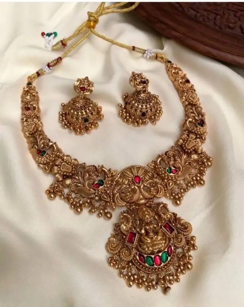 Gold lakshmi temple necklace set - bridal jewelry with ruby and emerald accents