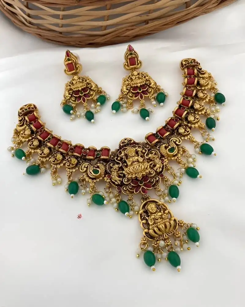 Luxurious lakshmi goddess temple jewelry necklace set - antique gold with emerald green and ruby red gemstones