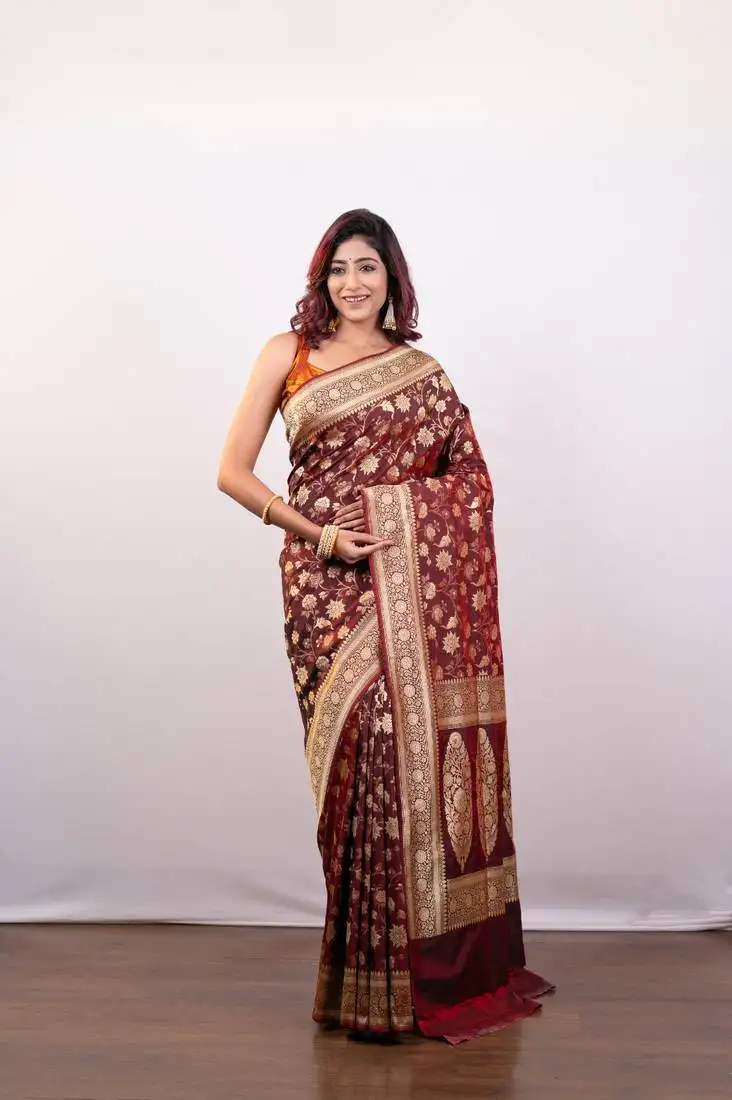 Maroon pure banarasi katan silk saree with golden floral jaal motifs and golden border pallu
