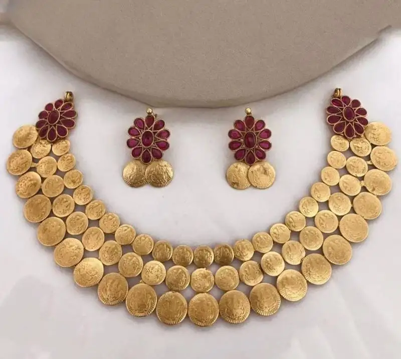 Traditional lakshmi coin necklace set with vibrant red stones - antique gold temple jewelry set