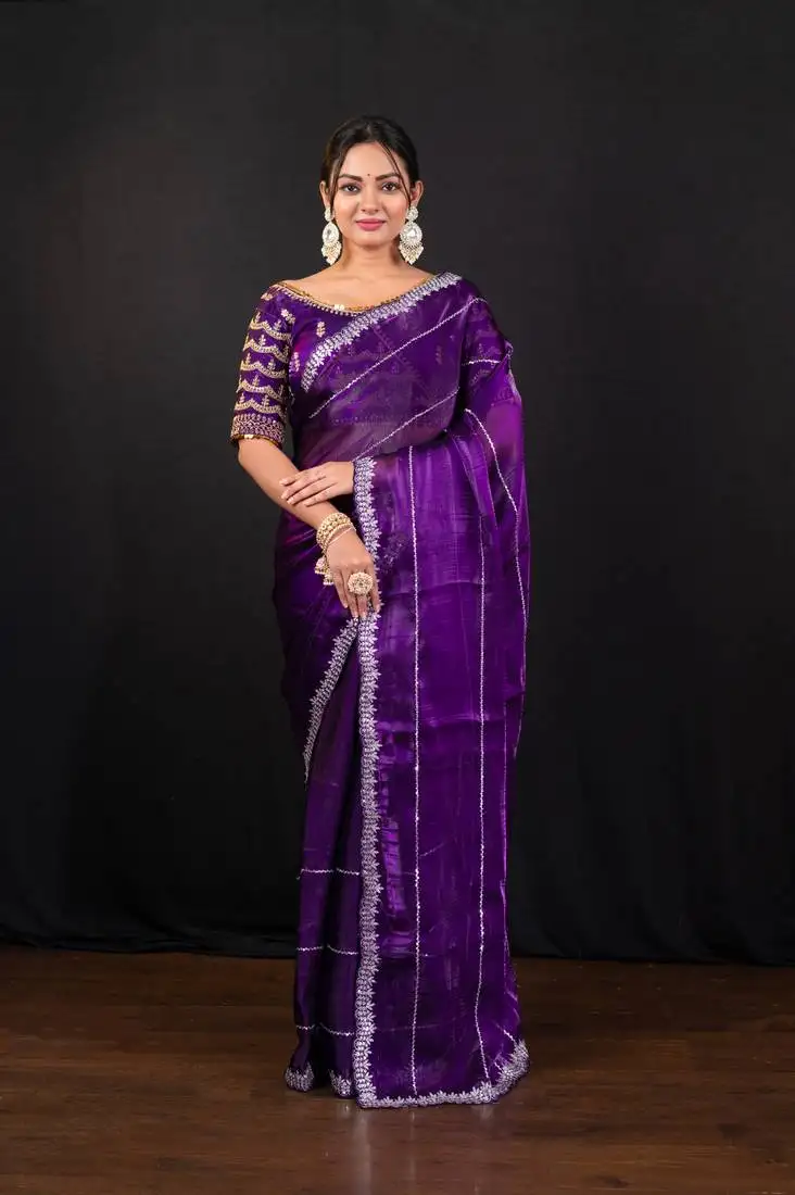 Dark purple jimmy choo saree with intricate silver embellishments and ready blouse