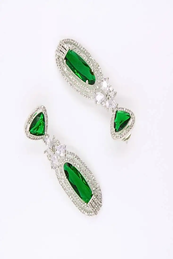 Green rhodium plated green stone zircon studded dangler earrings