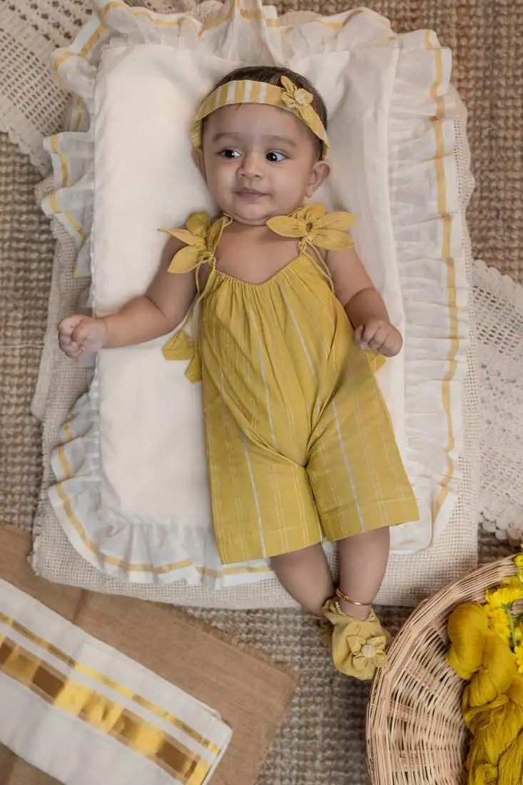 Yellow striped romper with headband and shoes.