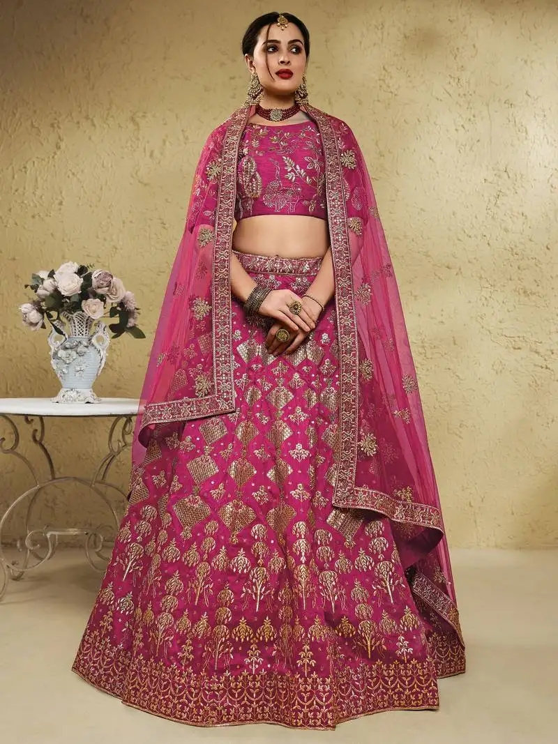 Pink thread embroidered silk lehenga choli with net dupatta