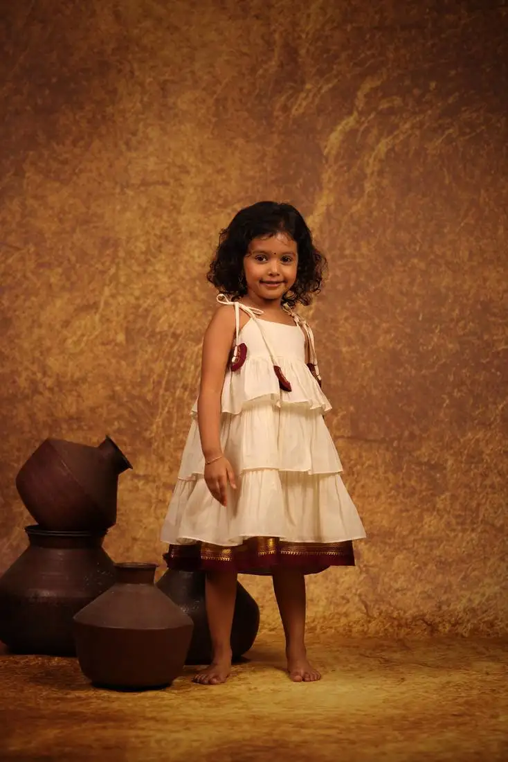 White cotton dress with maroon kanchipuram border at the hem