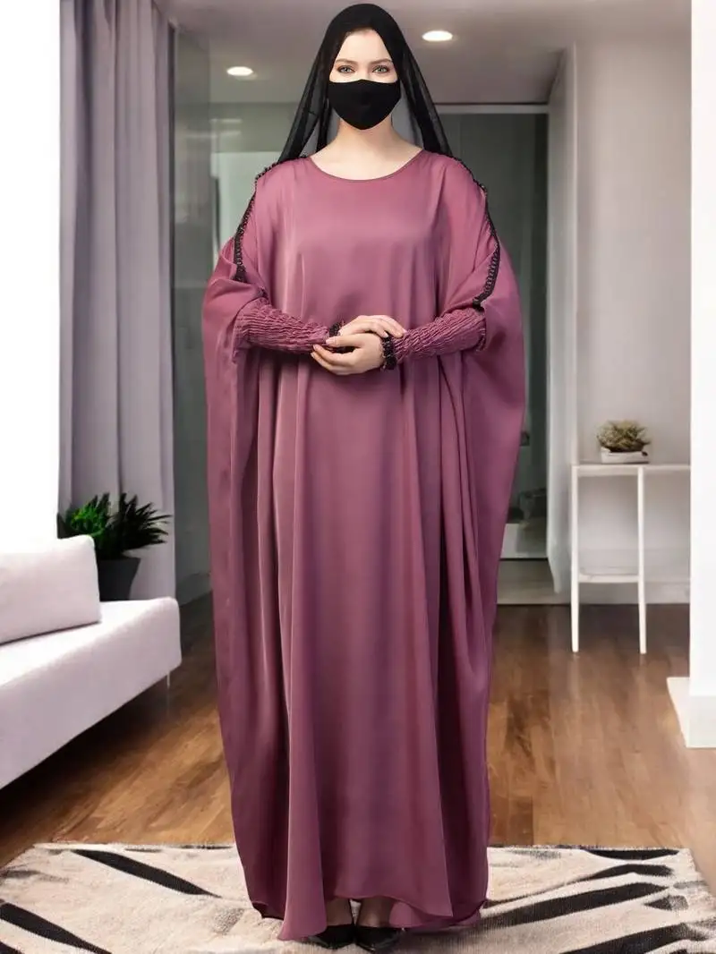 Pink free size kaftan with long elasticated sleeves.