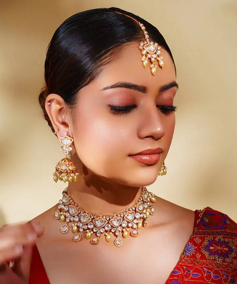 Bold and dramatic kundan polki necklace with earrings and maangtikka