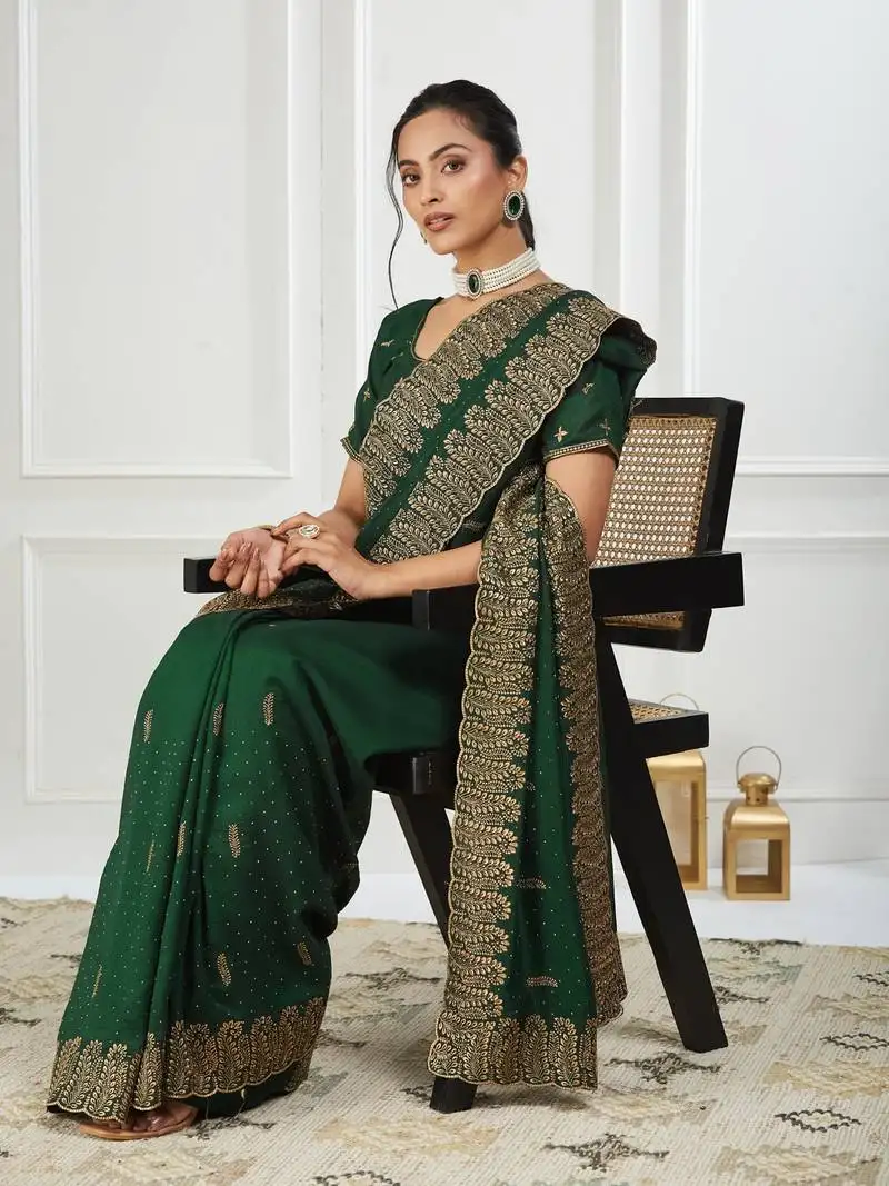 Green embroidered silk blend saree