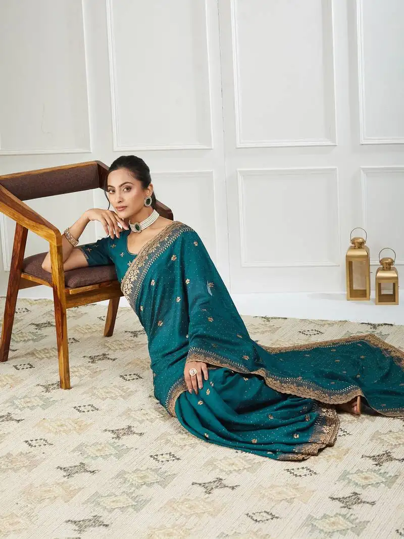 Teal embroidered silk blend saree