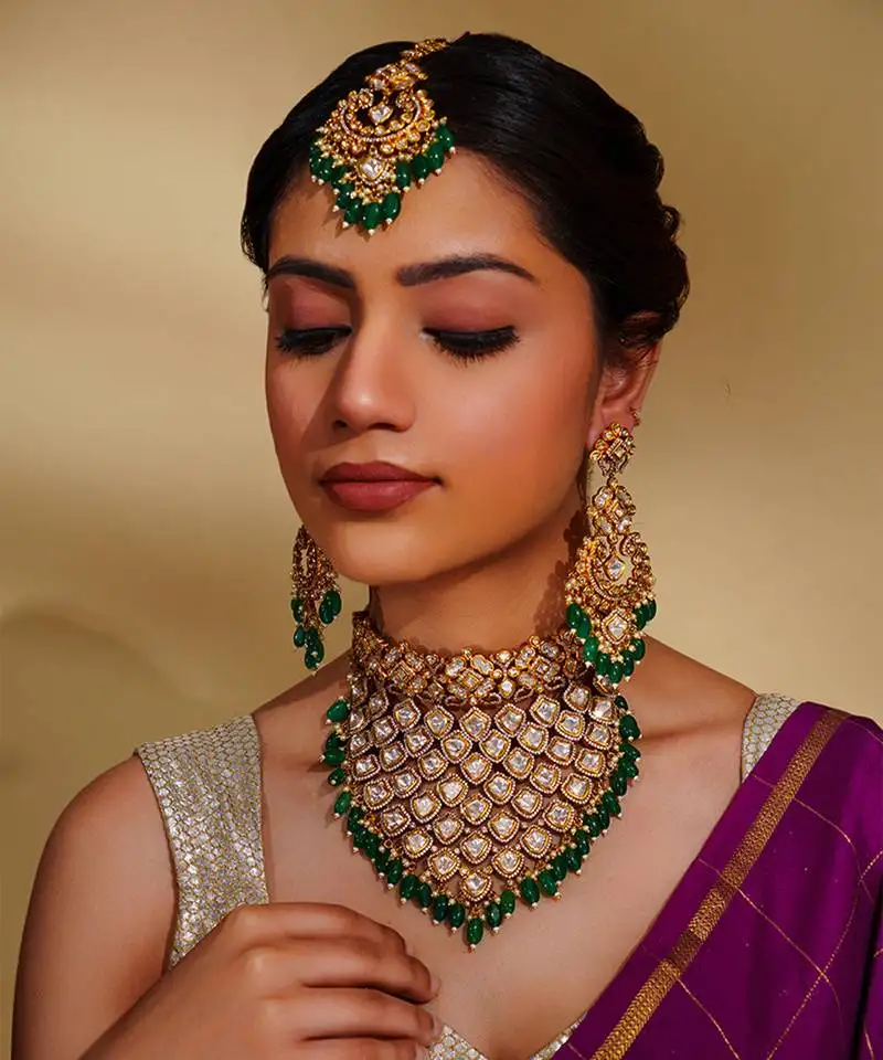 Bold and dramatic kundan necklace with earrings and maangtikka