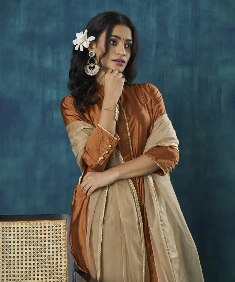 Rust tissue plain kurta with pant and dupatta.