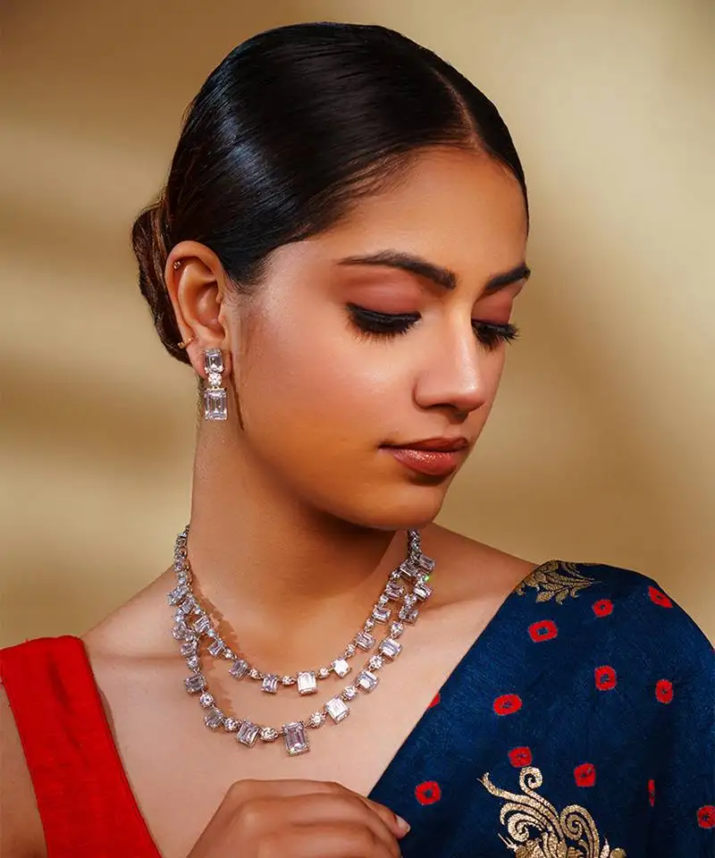 Delicate yet elegant diamond necklace in white finish with matching earrings