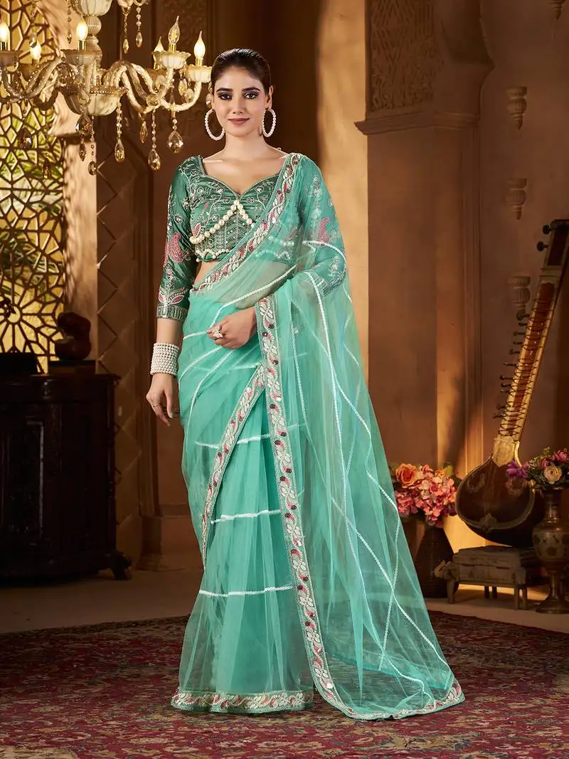 Blue net embroidery work saree with unstitched blouse piece